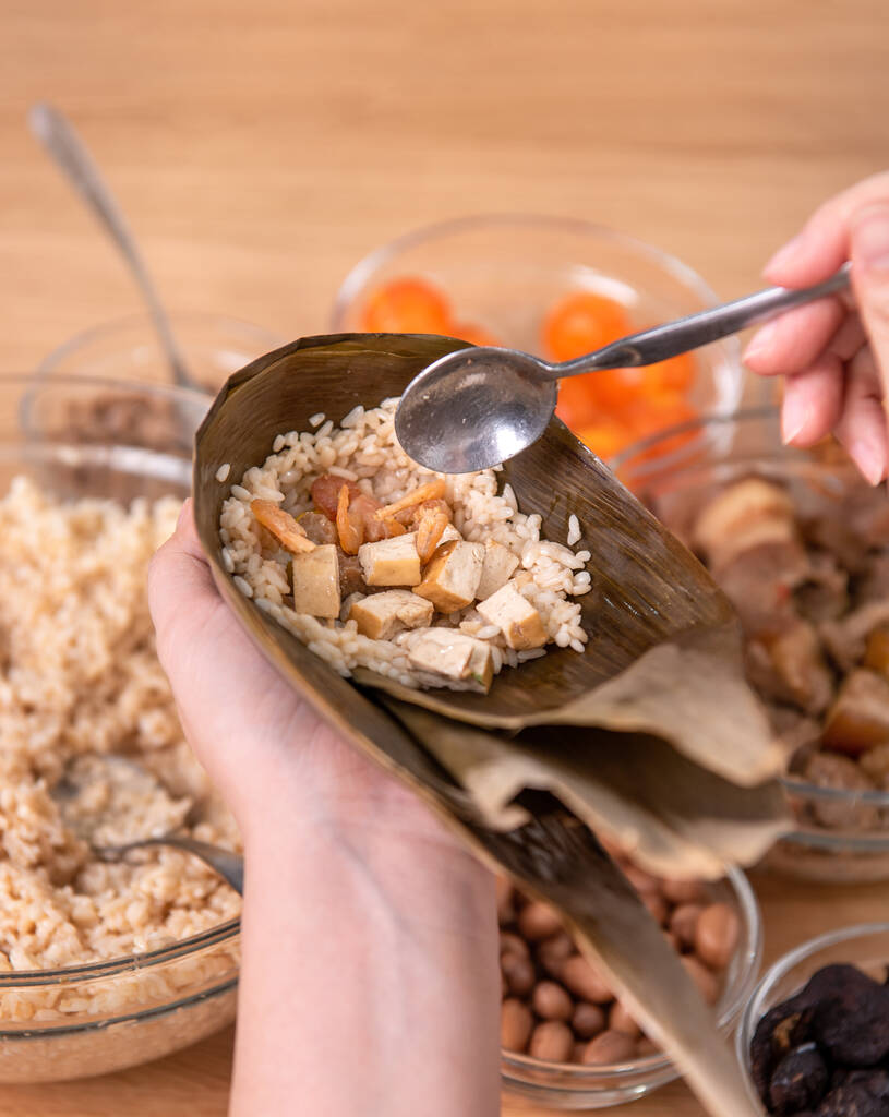 Zongzi, an ingredient for Chinese dumplings, is placed on a table at home during the Dragon Boat Festival celebration Zongzi, an ingredient for Chinese dumplings, is placed on a table at home during the Dragon Boat Festival celebration
