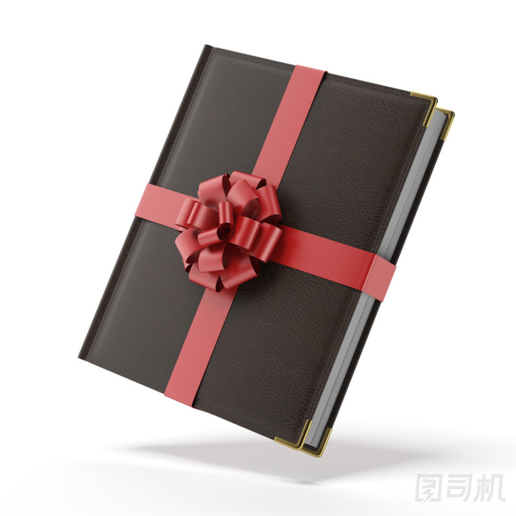 用一條紅絲帶包裹的書圖片