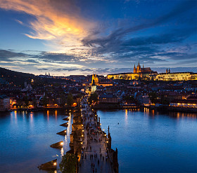 Voltava River bridge night view of Prague Castle and Charles