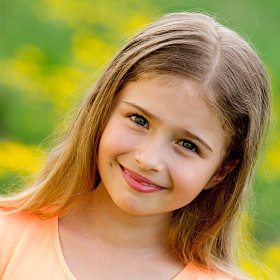 Happy child -- lovely girl in outdoor portrait