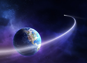 移动过去的行星地球的彗星图片
