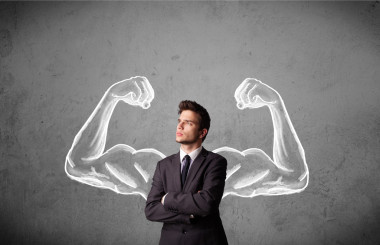 与强劲的肌肉武器商人照片