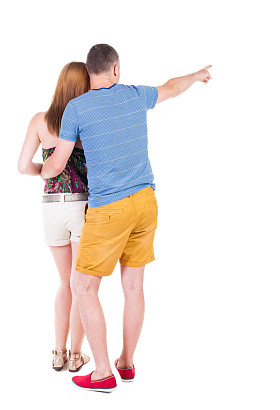 指向的年轻夫妇后视图图片
