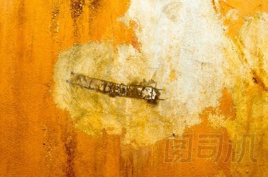 近攝鏡頭的生銹墻背景圖像
