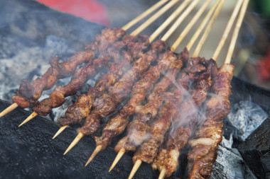 Delicious street food of Barbecued Lamb shish kebabs on the streets of Guilin, Guangxi Autonomous Region, China,
