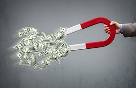 商人吸引磁铁的钱图片