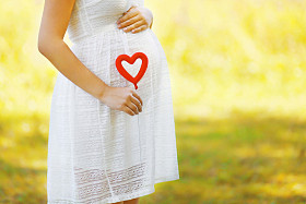 Conception of pregnancy, childbirth and new family - pregnant woman