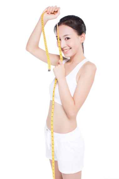 卷尺的女人圖片