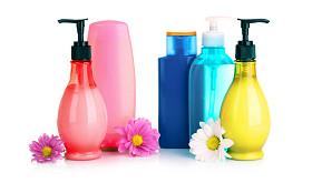 花和孤立在白色的液体肥皂图片