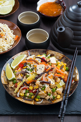 Asian lunch - fried rice, tofu and vegetables, vertical