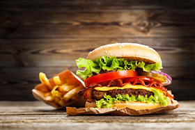 Delicious burger and fries at Batatas Fritas E Hamburguer Delicioso