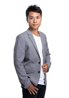 亚洲英俊商人在灰色夹克照片