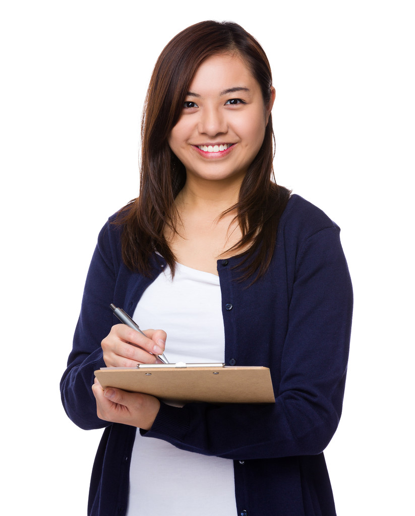 年轻的亚裔女子,在蓝色开衫图片 年轻的亚裔女子,在蓝色开衫图片