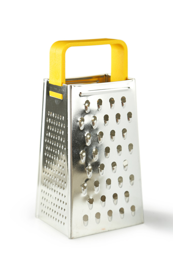 在白色背景上的金属磨碎机照片 在白色背景上的金属磨碎机照片