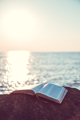 Picture on the stone of the Bible striking the sea