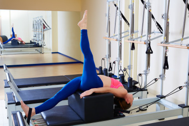 Pilates reformer woman short box tree exercise