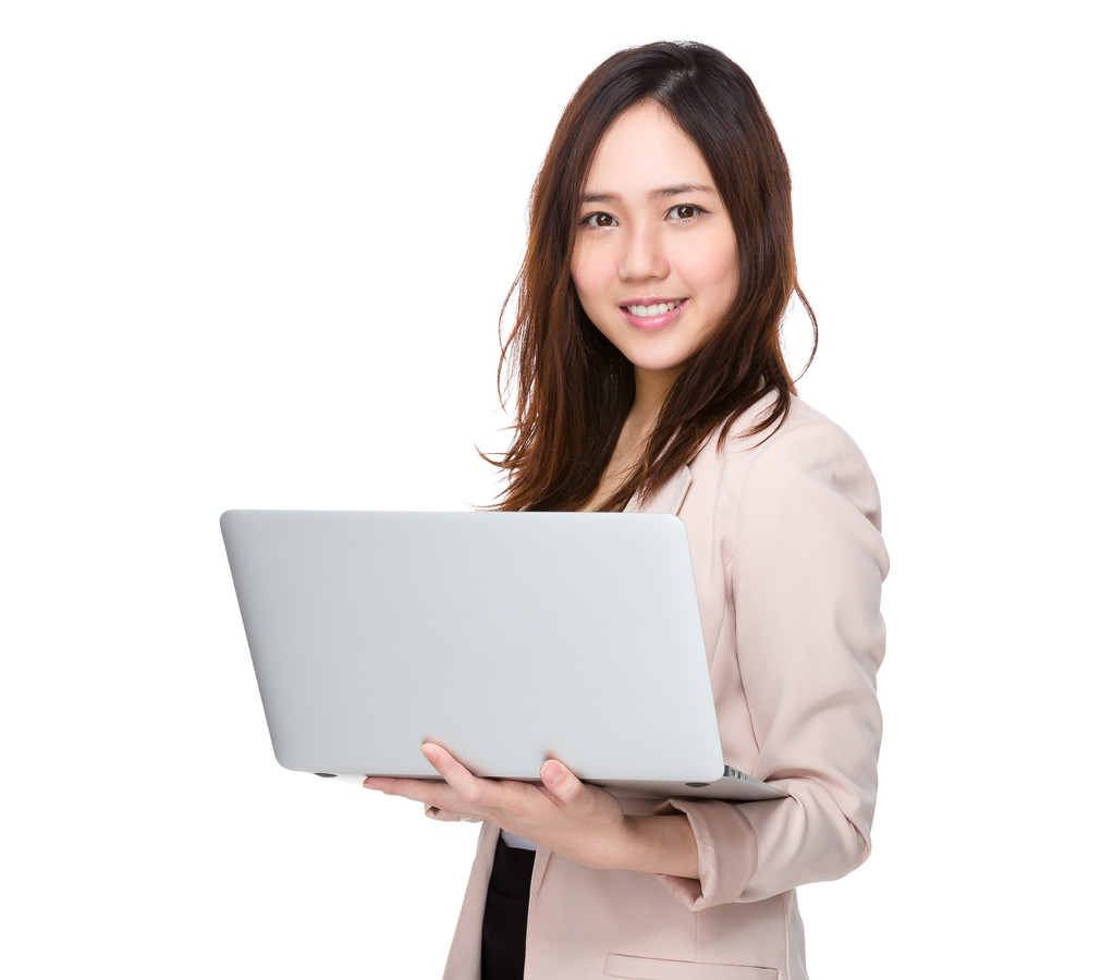 在商务套装的年轻亚洲女商人 在商务套装的年轻亚洲女商人