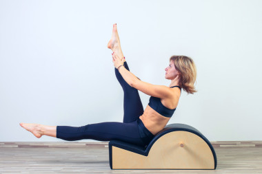 Pilates, fitness, sports, training and the concept of people -- women doing exercises on kegs