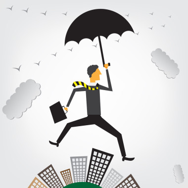 飛越城市景觀的商人圖片