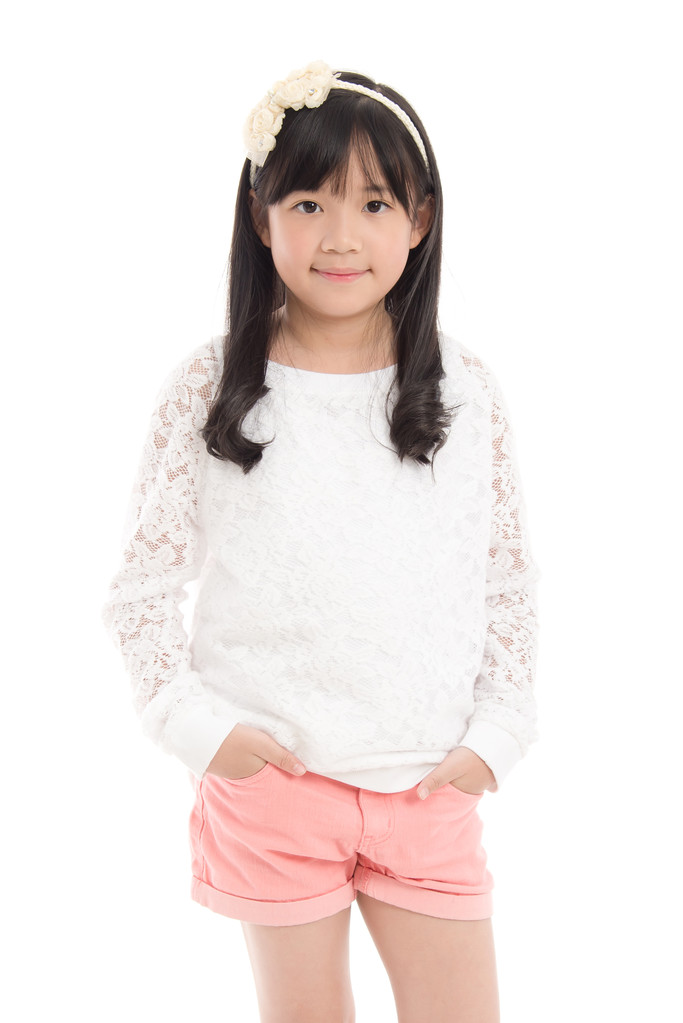 站在白色的背景分离的亚洲女孩 站在白色的背景分离的亚洲女孩