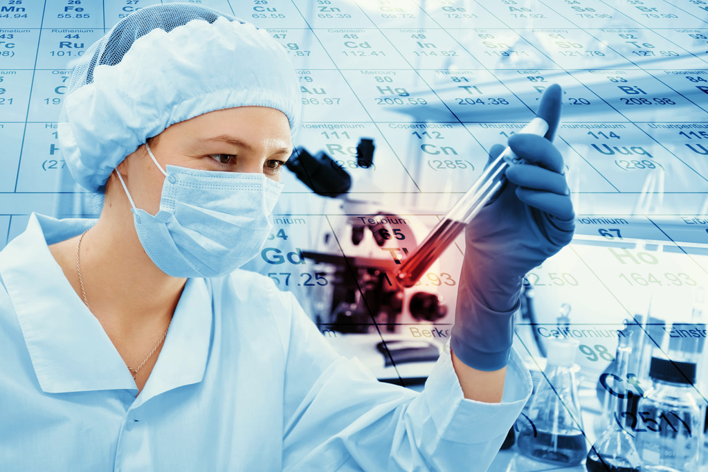 Science, chemistry, technology, biology, human concepts -- young female scientists mix reagents from glass flares and make tests or background studies with chemical tables in clinical laboratories