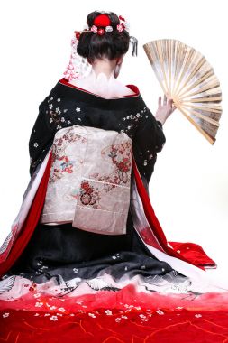 年轻漂亮的艺伎和服与樱花和装饰