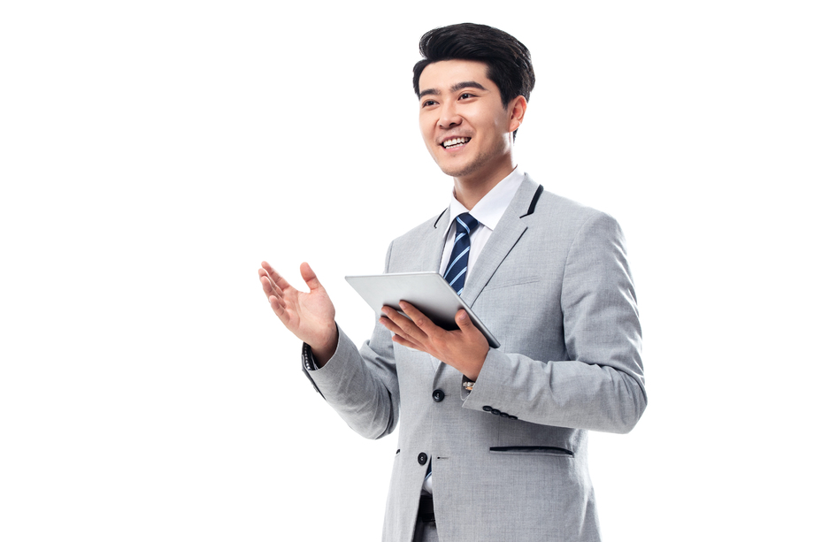 拿平板电脑的商务男士照片