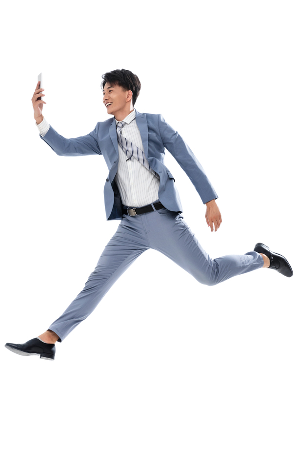 拿着手机奔跑跳跃的商务男士 拿着手机奔跑跳跃的商务男士
