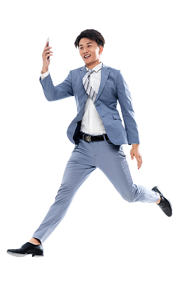 拿着手机奔跑跳跃的商务男士图片