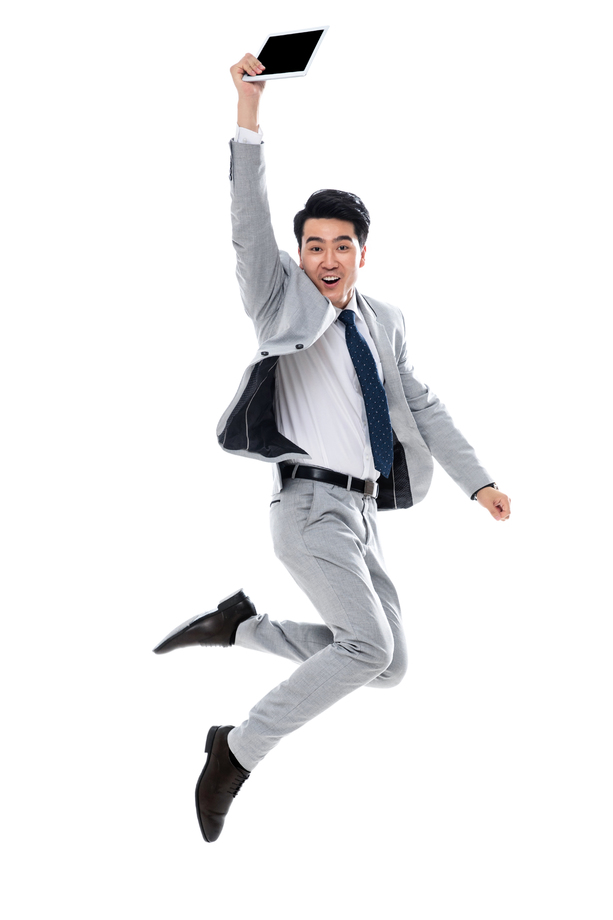 拿着平板电脑跳跃的商务男士 拿着平板电脑跳跃的商务男士