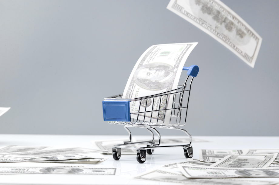 购物车和大量美国百元钞票图片 购物车和大量美国百元钞票图片