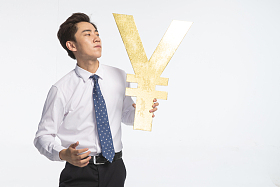 商务青年男人拿着人民币符号照片