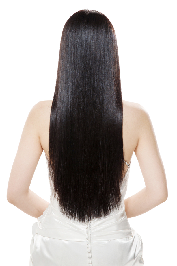 青年女人亮丽丝缎般的头发照片