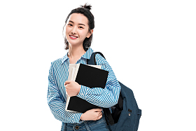 拿着书本的快乐女学生照片